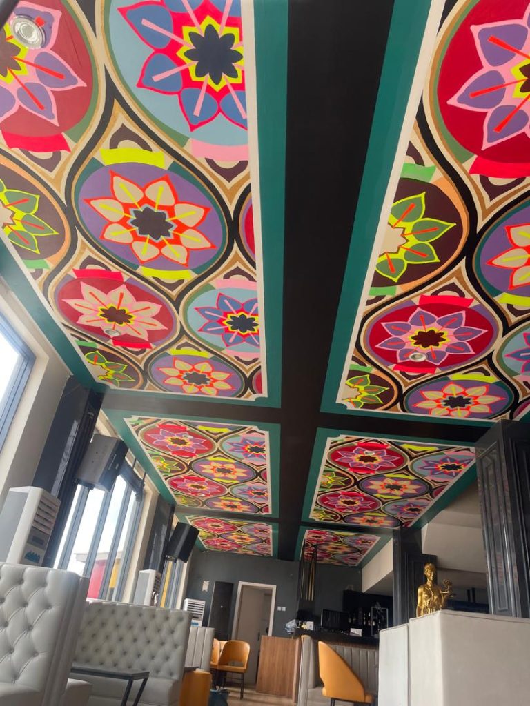 Mandala Design on a Bar Ceiling by Cedar Creative Art a beautiful mural showing characteristic fashionable patterns of flowers with mixed colors.