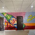 Colorful Mural of Life Beer Bottle and “For Progress” Slogan